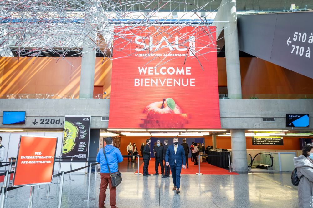 Pin's SIAL - Huile Astra Calvé - Salon International De L'Alimentation 1990 - Occasion